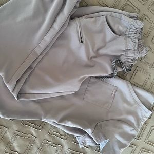 Gray JAANUU scrubs set.